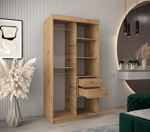 Wooden bookshelf with shelves and drawers in a room with decorative elements.