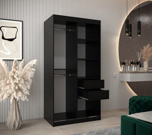 Black wardrobe with shelves and drawers in a room with decorative elements.