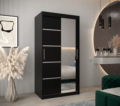 Black wardrobe with mirror in a bedroom setting