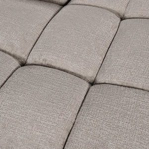 Close-up of a textured gray cushioned surface