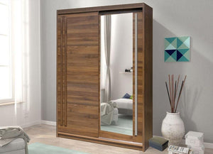 Wooden wardrobe with mirror in a room with a sofa and decorative items.