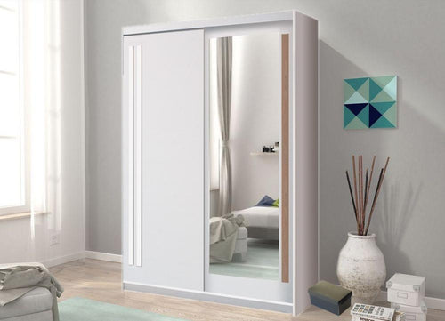 Sliding wardrobe door with mirror in a room with a sofa and decorative items.