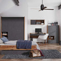 Modern bedroom with wooden bed, desk, and shelves.