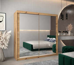 Wooden wardrobe with sliding mirrors in a bedroom setting