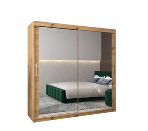 Wooden wardrobe with sliding mirror doors in a bedroom setting