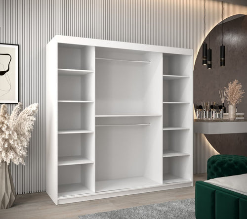 White wardrobe with shelves in a room with a decorative wall and furniture.