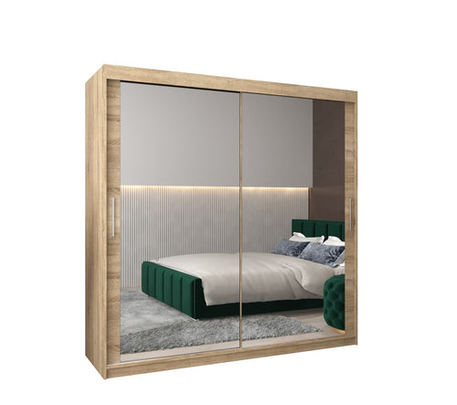 Wooden wardrobe with sliding mirror doors in a bedroom setting