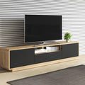 Modern TV stand with a television on a neutral wall background