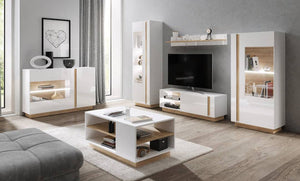 Modern living room with white and wood furniture, including a TV stand and coffee table.