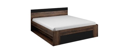 Wooden bed frame with white mattress on a white background