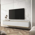 Modern living room with a white entertainment console and TV against a marble wall.