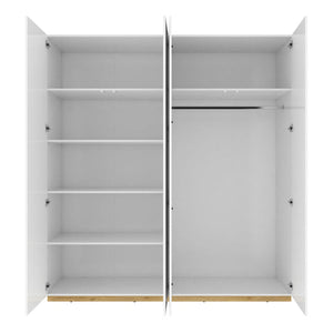 White wardrobe with open doors on a white background