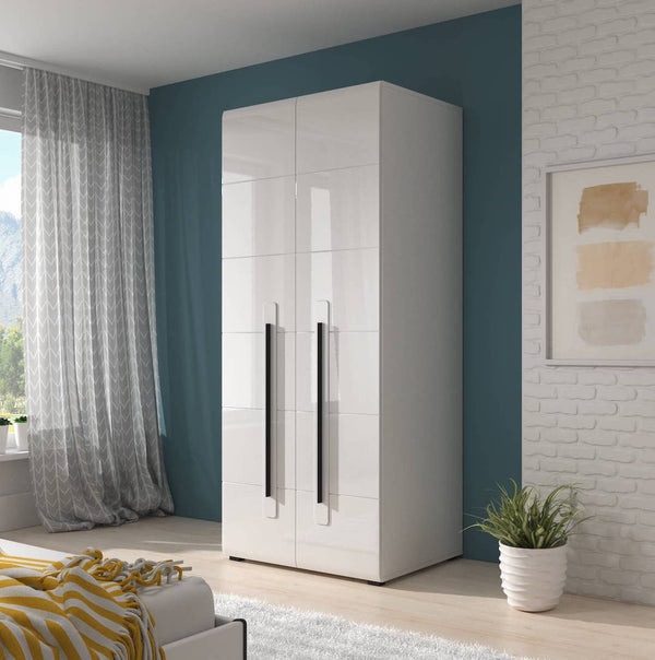 White wardrobe in a modern bedroom with blue walls and a plant.