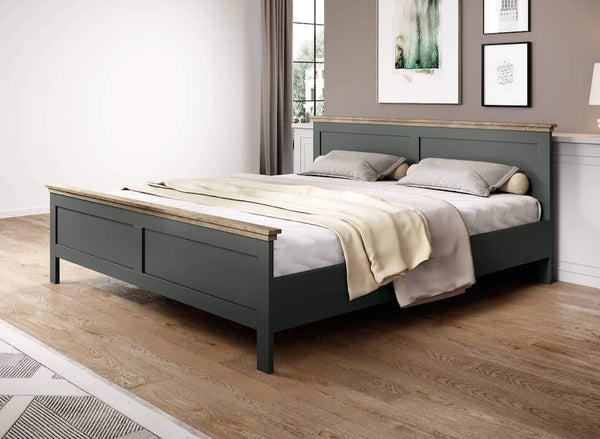 Gray bed frame with wooden accents in a bedroom setting.