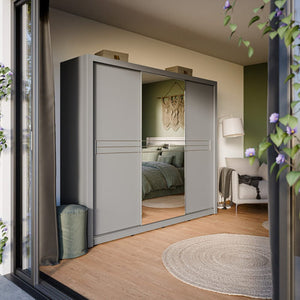 Modern sliding wardrobe in a stylish bedroom with wooden floor and decorative elements.