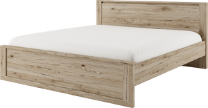 Wooden bed frame with white mattress on a white background