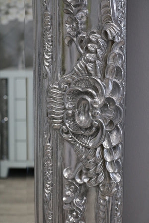 Decorative silver mirror with intricate floral patterns