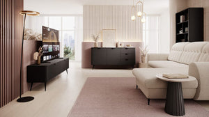 Modern living room with a beige sofa, coffee table, and television.