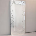 Rectangular mirror with geometric frame on a plain wall