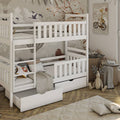 White bunk bed with pull-out drawer in a child's room with toys and decor.