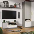 Living room setup with a TV, speakers, and a wardrobe.