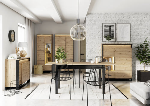 Modern dining room with wooden furniture and decorative elements.