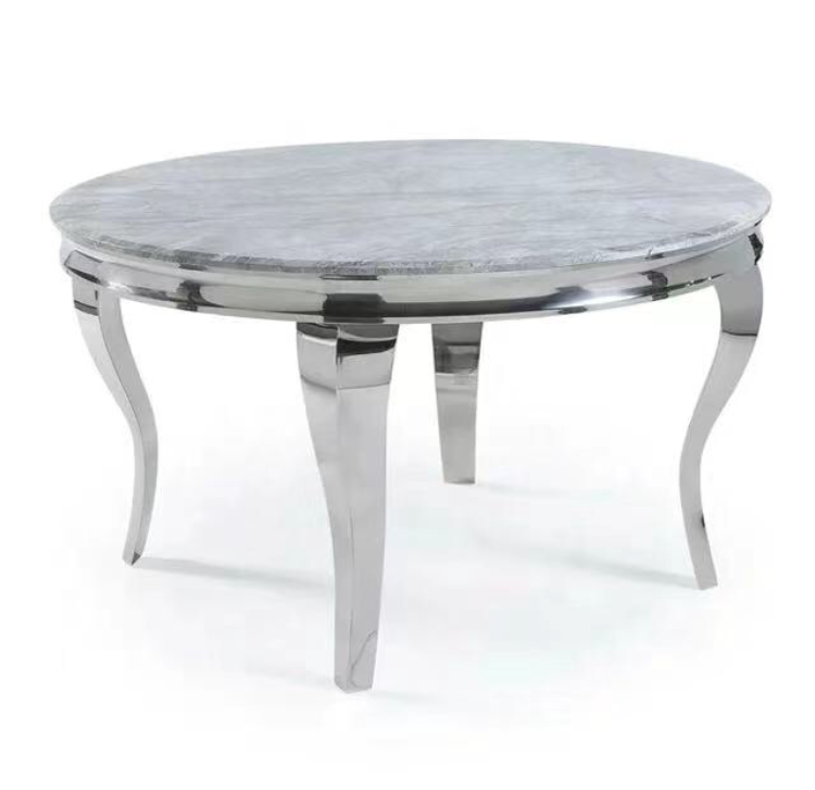 Round marble table with chrome legs on a white background