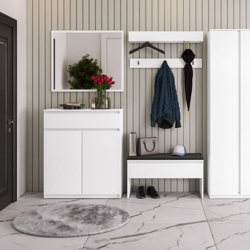 White entryway console with mirror, coat rack, and bench against a striped wall.