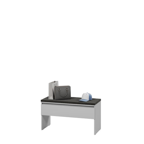 Small desk with a black top and white frame on a white background