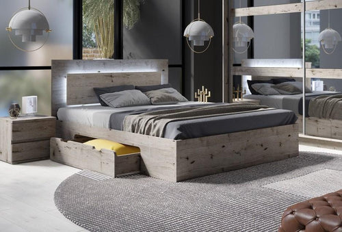 Modern bedroom with wooden bed, nightstands, and decorative elements.