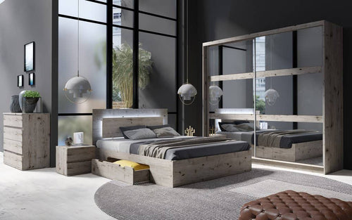 Modern bedroom with a large bed, nightstands, and a wardrobe.