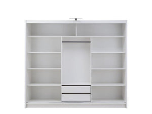 White wardrobe with sliding doors and shelves on a white background