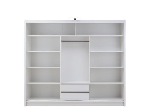White wardrobe with sliding doors and shelves on a white background