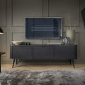 Modern living room with a television mounted on a gray wall, a sideboard with decorative items, and a lamp.