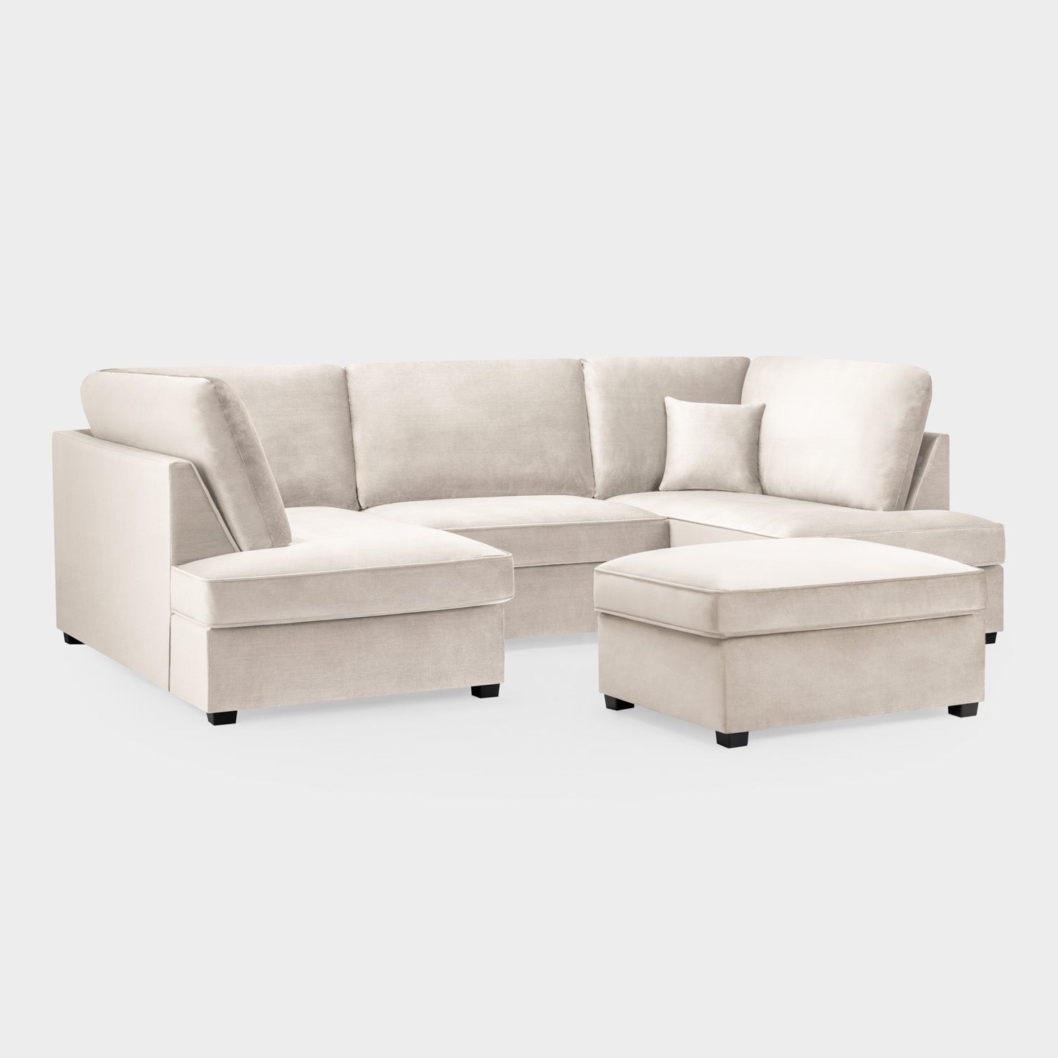 Beige sectional sofa with ottoman on a white background