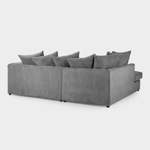 Gray sectional sofa with multiple cushions on a white background