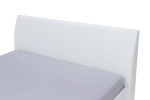 White bed frame with a fitted sheet on a white background
