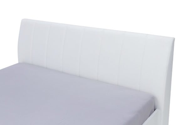 White bed frame with a fitted sheet on a white background