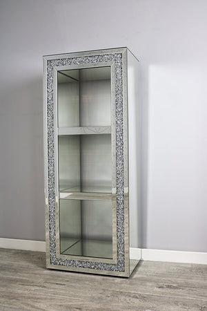 Decorative cabinet with crystal embellishments on a plain wall.