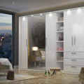 Modern bedroom with a large white wardrobe, bed, and cityscape view.