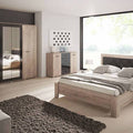 Modern bedroom with wooden furniture including a bed, wardrobes, and nightstands.