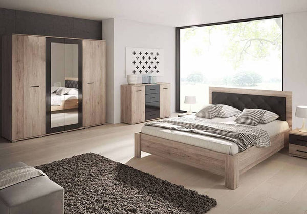 Modern bedroom with wooden furniture including a bed, wardrobes, and nightstands.