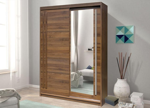 Wooden wardrobe with mirror in a room with a sofa and decorative items.