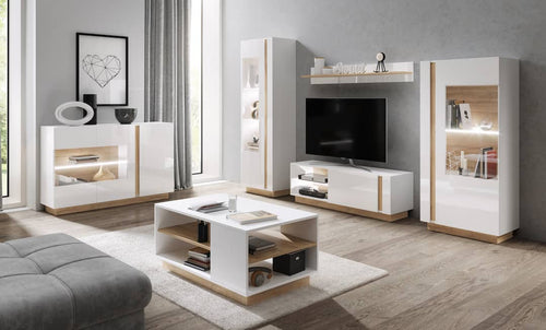 Modern living room with white and wood furniture, including a TV stand and coffee table.