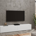 Modern living room with a white TV stand, black TV, and decorative items.