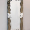 Decorative wall mirror with zigzag pattern on a white background