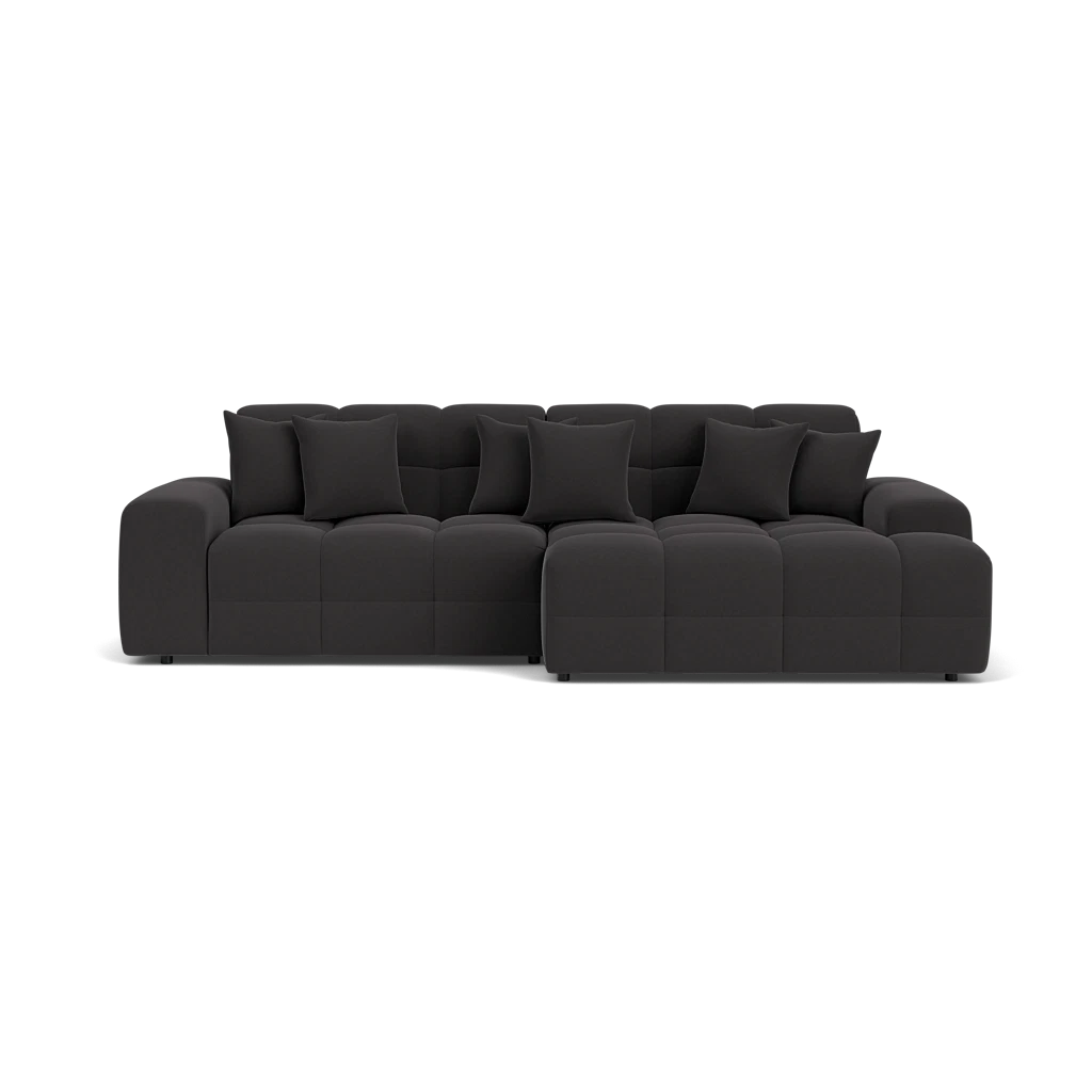 Black sectional sofa on a white background