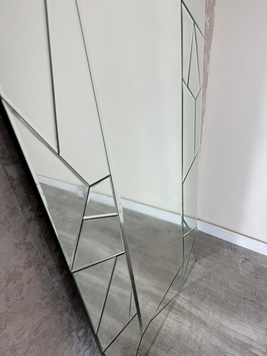 Modern glass cabinet with geometric design on a neutral background