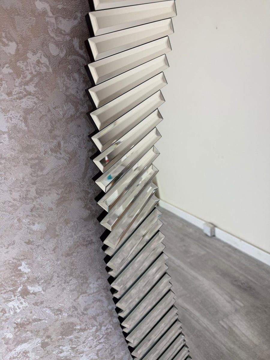 Metallic radiator against a wall in a room with a concrete floor.