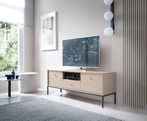 Modern living room with a television on a wooden stand.